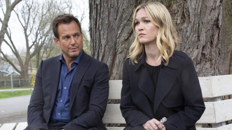 Jeff and Georgina sit on a bench by a tree in Riviera (2017)