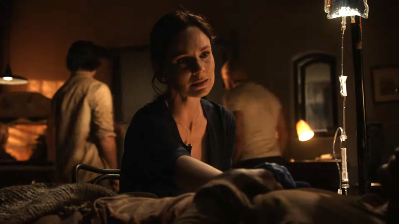 Sara Tancredi sitting over Michael Scofield's bed in Prison Break