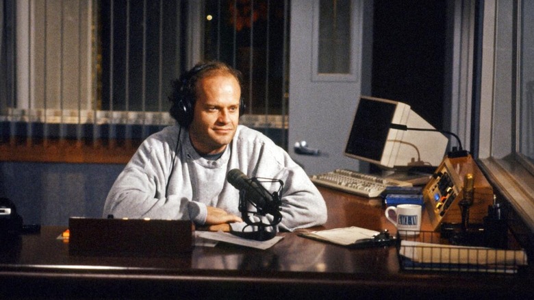 Frasier Crane talking into a microphone in "Frasier"