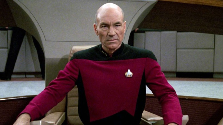 Captain Jean-Luc Picard sitting in his command chair in "Star Trek: The Next Generation"