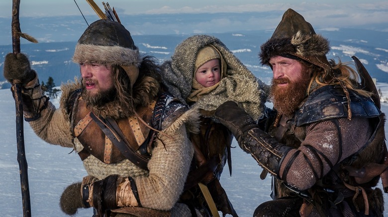 Torstein and Skjervald together on the ice with a baby in "The Last King"
