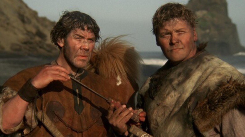Gestur and Thord standing together on a beach in "When the Raven Flies"