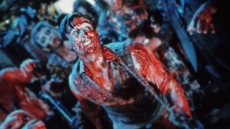Lionel runs from a zombie horde in "Braindead" (1992)