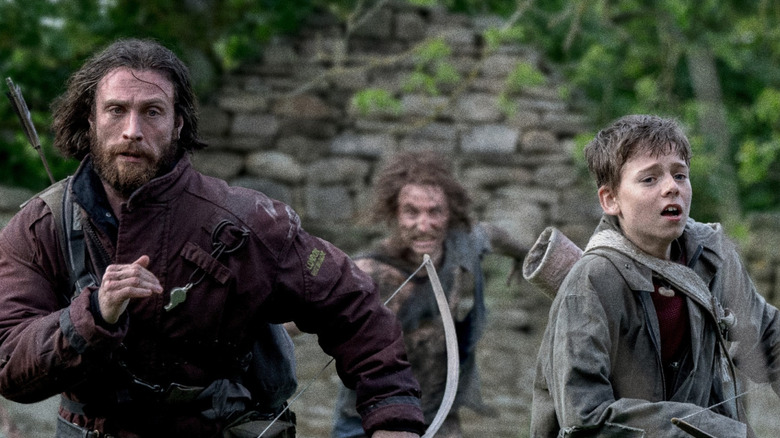 Jamie and Spike are pursued by the Infected in "28 Years Later" (2025)