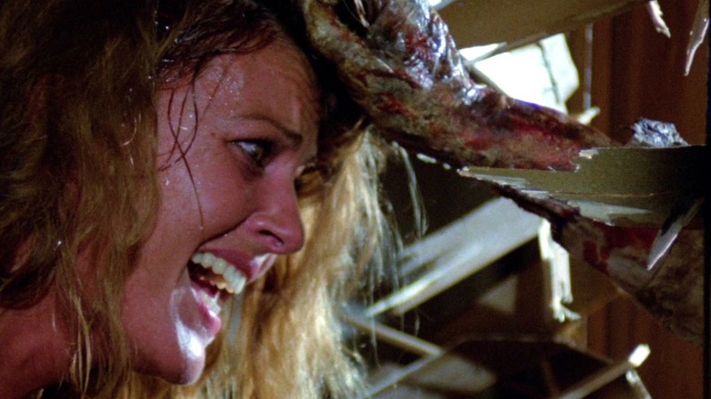 A zombie gives a woman an eyeful in "Zombi 2" (1979)