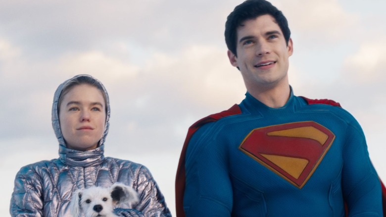 Superman standing alongside Supergirl and Krypto in Supergirl