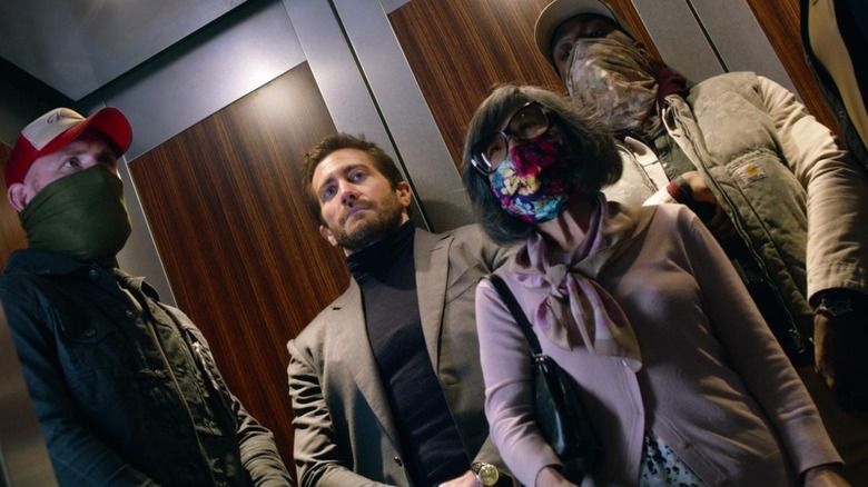 Will and Danny Sharp in an elevator with other masked riders in Ambulance (2022)