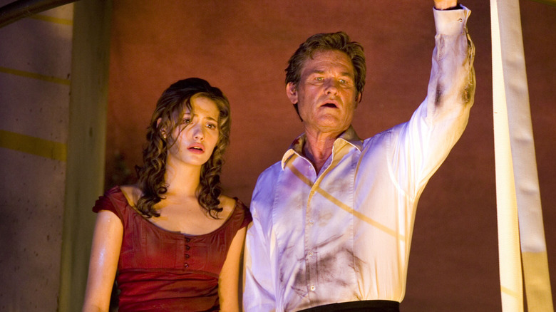 Jennifer and Robert Ramsey looking shocked in Poseidon (2006)