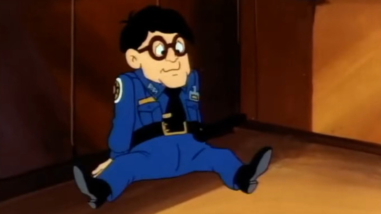 Carl Sweetchuck sitting on the floor in Police Academy