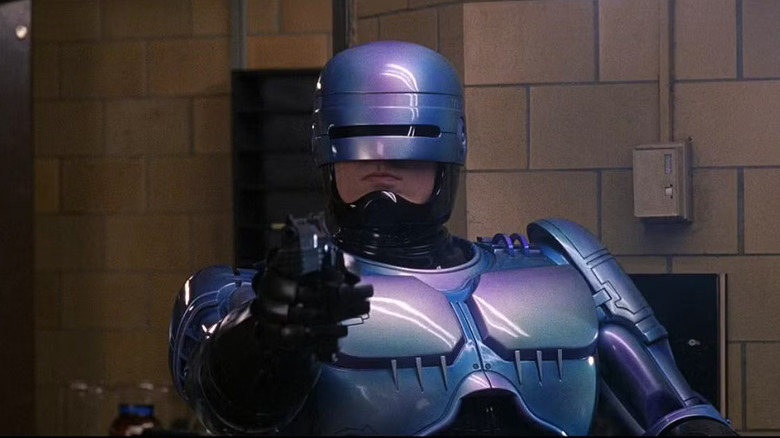 RoboCop aiming a pistol in RoboCop 2 (1990)