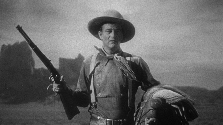 The Ringo Kid holds his rifle in Stagecoach (1939)