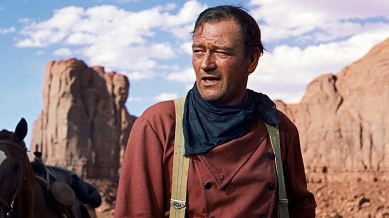 Ethan Edwards looks out over the desert in The Searchers (1956)