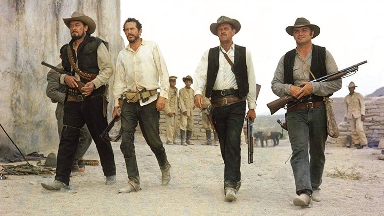 Pike Bishop and his outlaw gang walk in The Wild Bunch (1969)