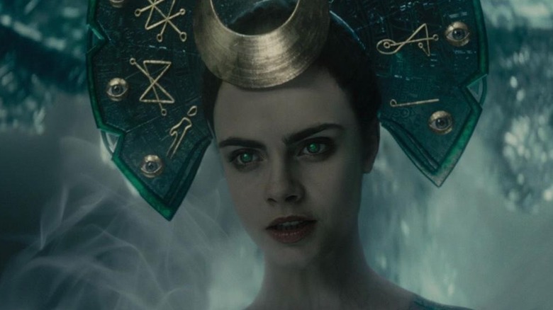The Enchantress, wearing a large headdress, gazing upon her prey in Suicide Squad (2016)