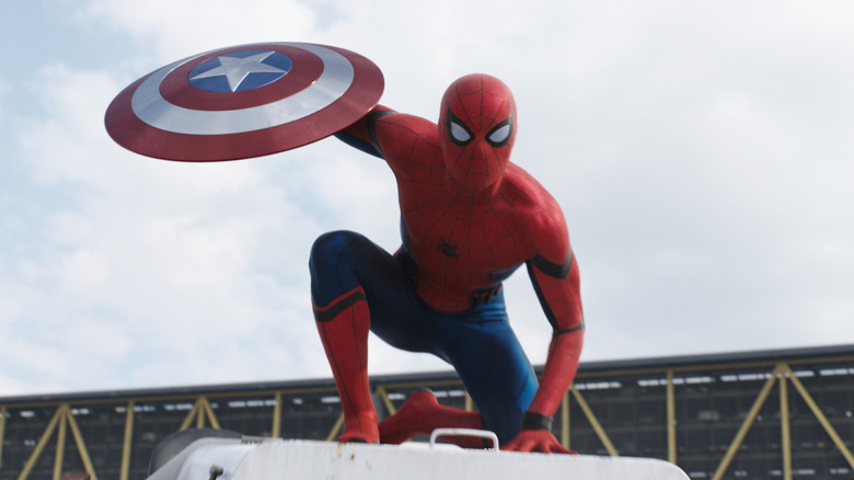 Spider-Man holding Captain America's shield in Captain America: Civil War (2016)