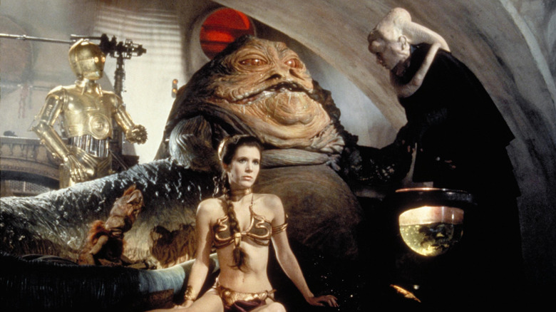 Princess Leia chained to Jabba the Hutt on Tatooine in Star Wars: Return of the Jedi