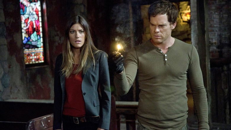 Debra and Dexter looking at burning match in Dexter