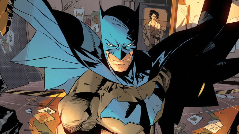 Batman standing menacingly amidst a crime scene