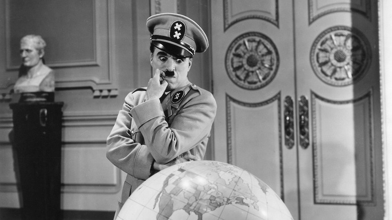Adenoid Hynkel stares at a globe in "The Great Dictator" (1940)