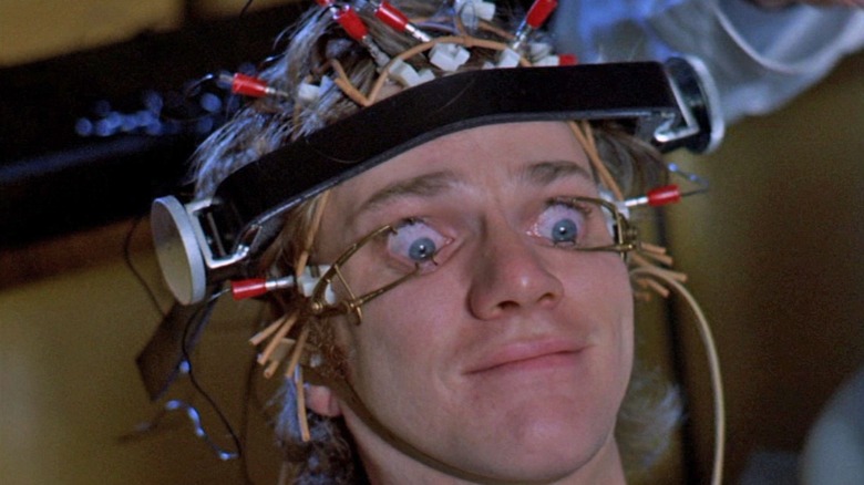 A device holds Alex's eyes open in "A Clockwork Orange" (1971)