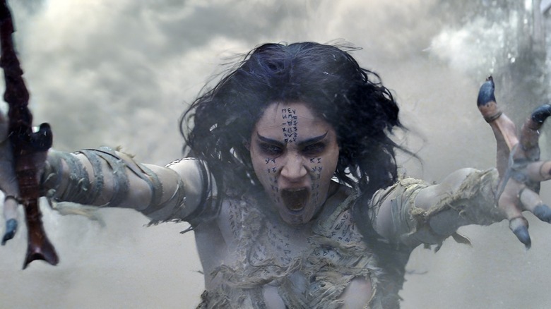 The Mummy holds out her arms and summons a sandstorm in The Mummy (2017)