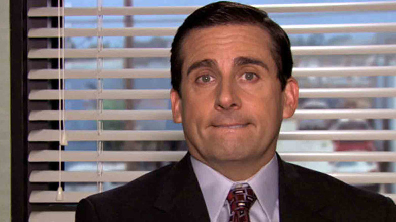 Michael Scott biting his lip in The Office
