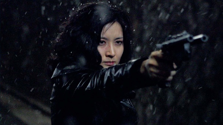 Lee Geum-ja pointing a handgun