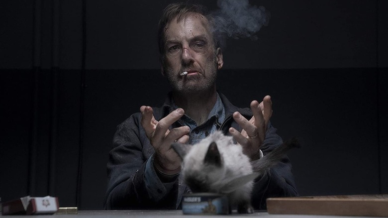 Hutch smoking cigarette with cat