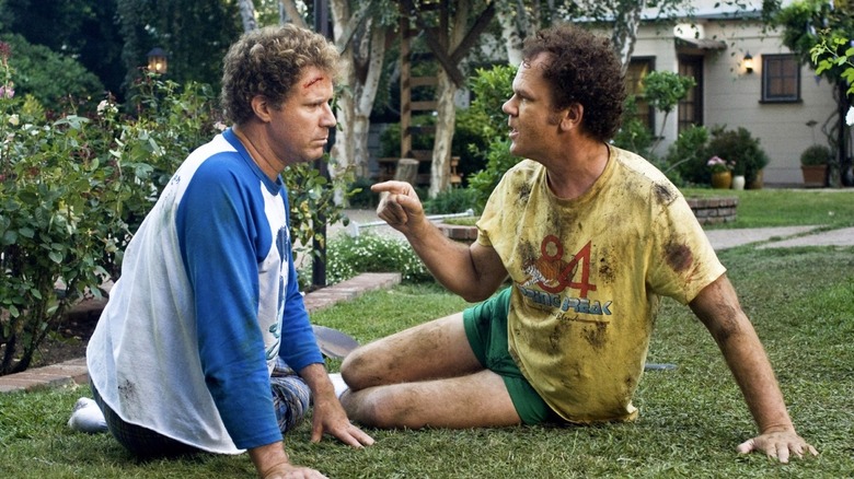 Brennan and Dale covered in dirt and blood fighting on their front lawn in Step Brothers