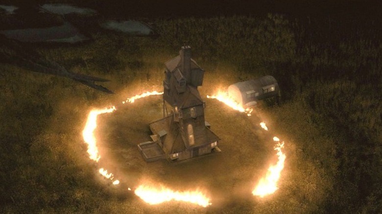 The Burrow surrounded by a ring of fire in Harry Potter anf the Half-Blood Prince