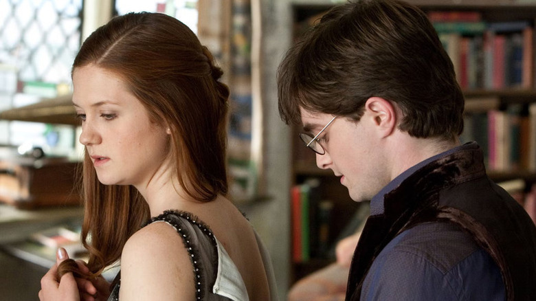 Harry buttoning the back of Ginny's dress in Harry Potter and the Deathly Hallows - Part 1