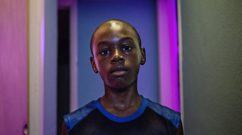 Young Chiron in a hallway in Moonlight