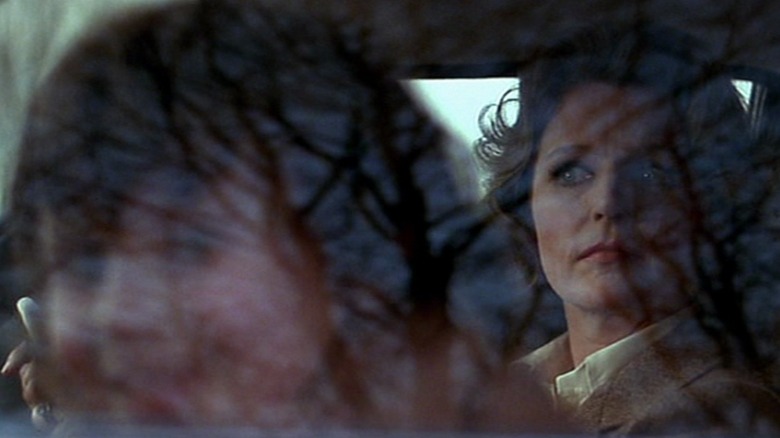 Lee Remick as Katherine and Harvey Stephens as Damien, seen through a car window in The Omen