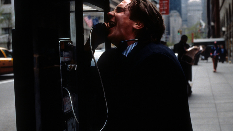 Patrick Bateman talks on a pay phone in 'American Psycho' (2000)