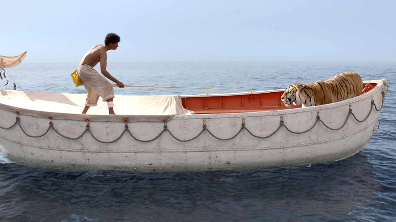 Pi wrangles a tiger in 'Life of Pi' (2012)