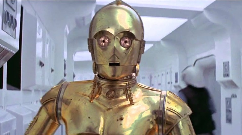 C-3PO rushing through the hallway of a rebellion ship