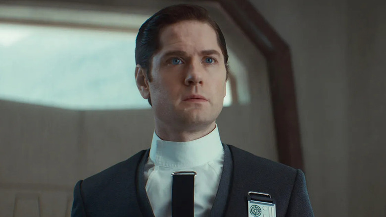 Syril Karn standing in a futuristic space