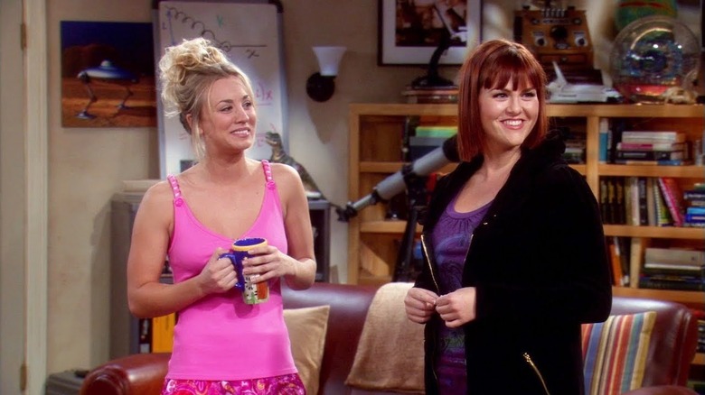 Penny and Stephanie laughing in the living room on The Big Bang Theory