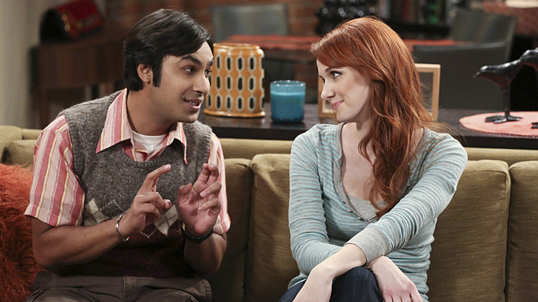 Raj and Emily sitting on his couch talking on The Big Bang Theory