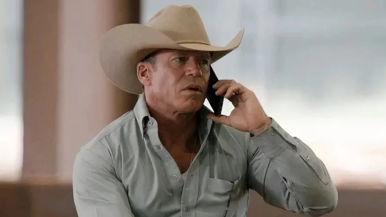 Travis Wheatley on the phone on horseback on Yellowstone (2018-2024)