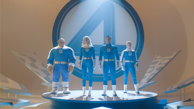 The Fantastic Four standing together on a platform in 