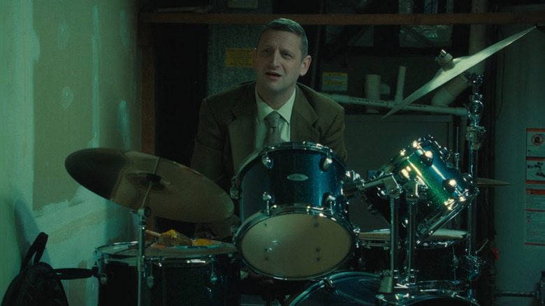 Craig Waterman behind a drum set in "Friendship"