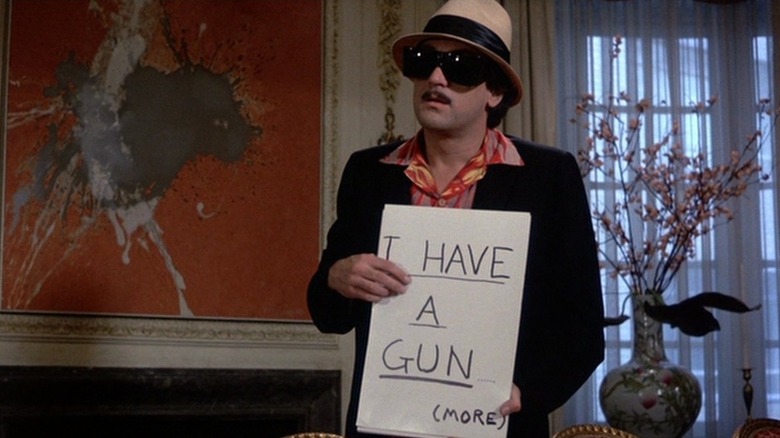 Rupert Pupkin holding a sign in "The King of Comedy"