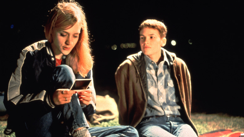 Brandon and Lana sitting outside in "Boys Don't Cry"