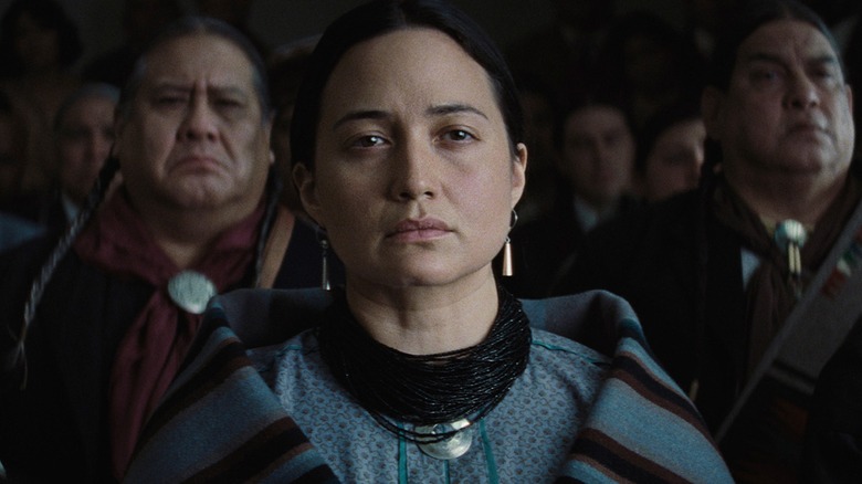 Mollie, wrapped in an Osage blanket, looks solemn in Killers of the Flower Moon