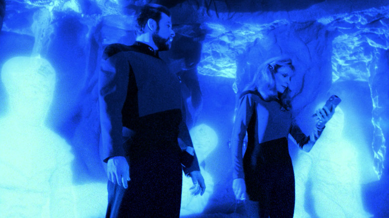 Riker and Crusher scan the Devidians in a cave in Star Trek: The Next Generation