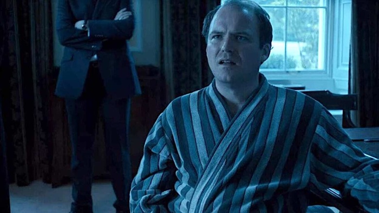 Michael Callow in a robe looking shocked on Black Mirror