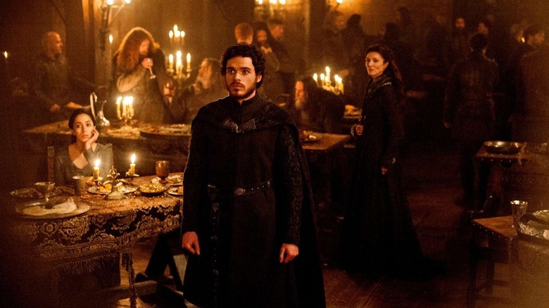 Robb standing in front of Talisa and Catelyn at the Red Wedding on Game of Thrones