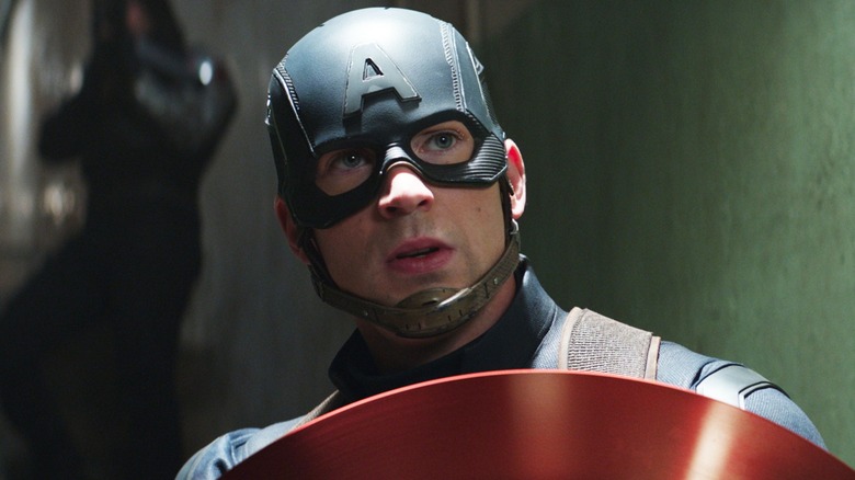 Captain America holding his shield with Bucky behind him in "Captain America: Civil War"