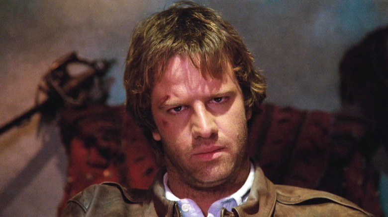 Connor MacLeod sitting on a chair in Highlander